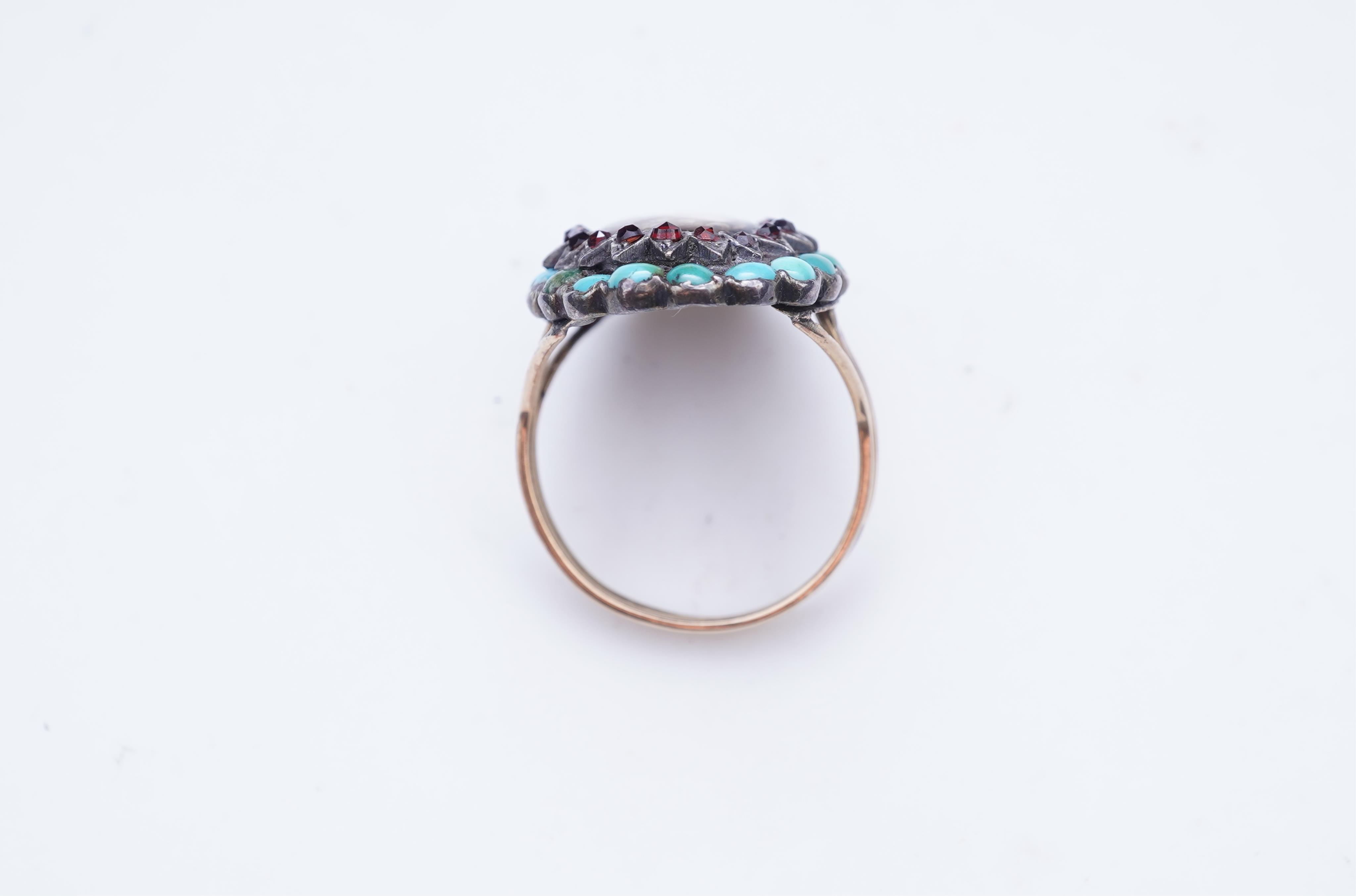 An enamel miniature, turquoise and garnet ring
